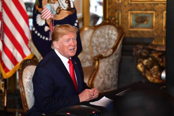 President Donald Trump makes a video call to the troops stationed worldwide at the Mar-a-Lago estate in Palm Beach, Fla., on Dec. 24, 2019. (Nicholas Kamm/AFP via Getty Images)