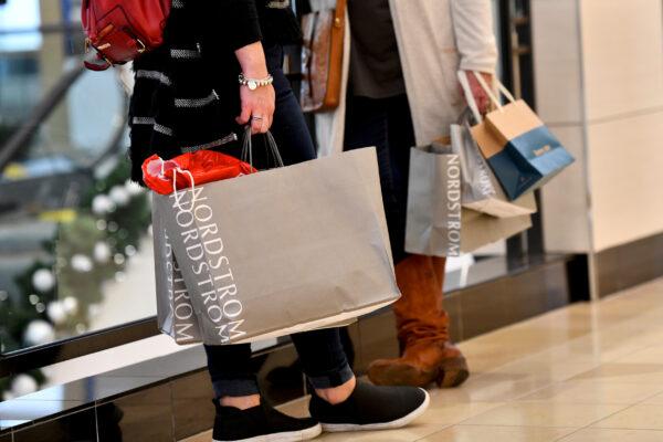 Shoppers clutch their Nordstrom bags as pre-Thanksgiving and Christmas holiday shopping accelerates at the King of Prussia Mall in King of Prussia, Pa., on Nov. 22, 2019. (Mark Makela/Reuters)