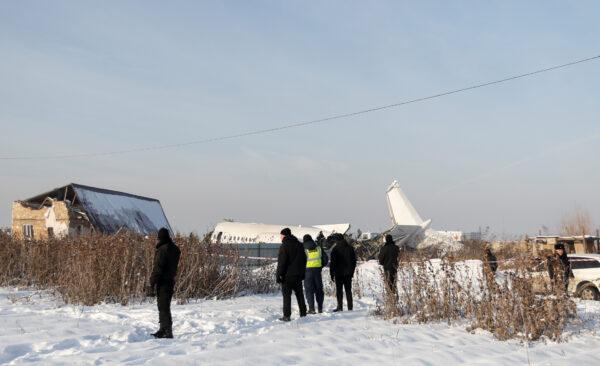 Emergency and security personnel are seen at the site of a plane crash near Almaty, Kazakhstan, on Dec. 27, 2019. (Pavel Mikheyev/Reuters)