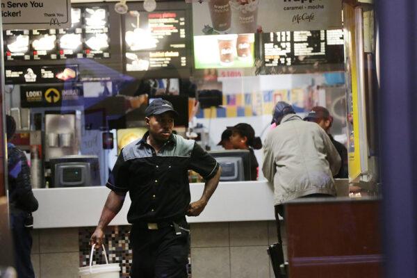 A McDonald's worker walks into a restaurant in New York on Nov. 10, 2015. (Spencer Platt/Getty Images)