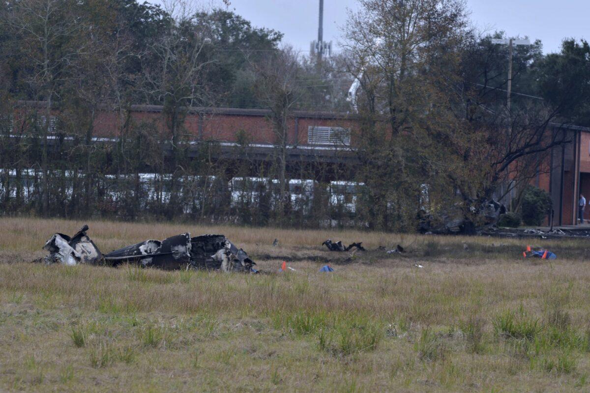 A view of the burnt wreckage of a plane crash near Feu Follet Road and Verot School Road in Lafayette, Louisiana, on Dec. 28, 2019. (Scott Clause/The Lafayette Advertiser via AP)