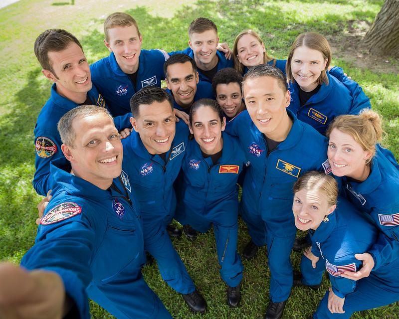 NASA Astronaut Class 22 huddles in for a group photo on Aug. 7, 2019. (©NASA | <a href="https://www.flickr.com/photos/nasa2explore/49229912086/in/album-72157698260056092/">Bill Stafford</a>)