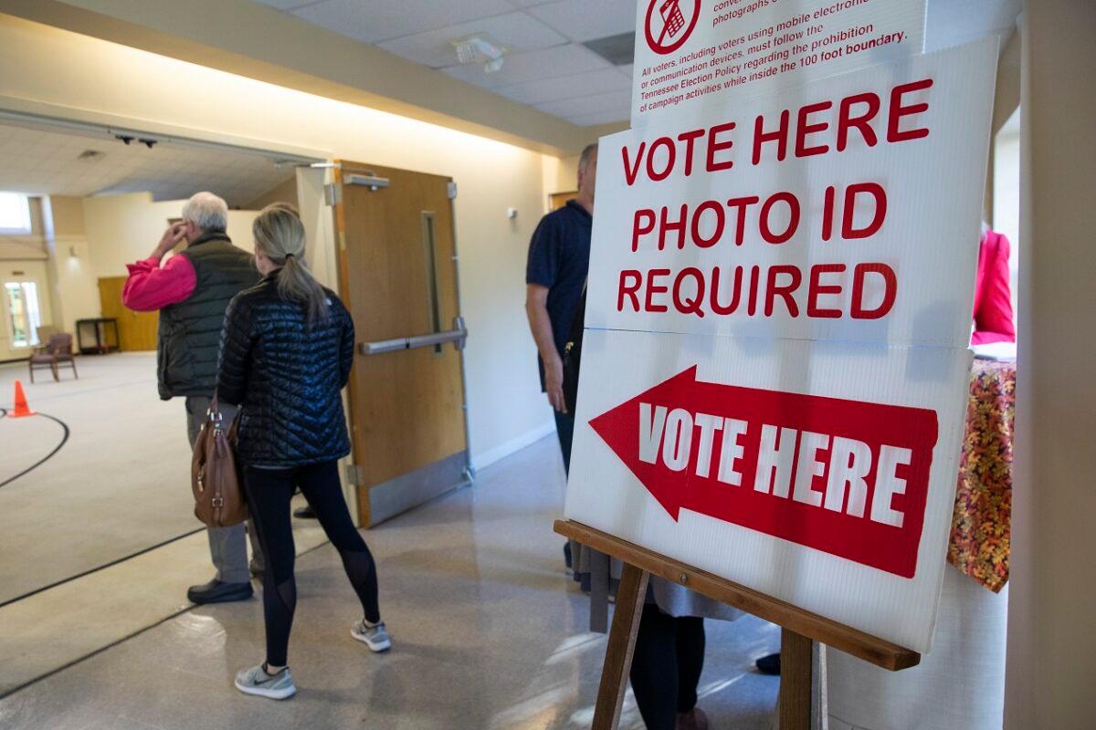A sign reminds voters they need photo ID to vote on Election Day at a polling station at Hillsboro Presbyterian Church, in Nashville, Tenn., on Nov. 6, 2018. (Drew Angerer/Getty Images)