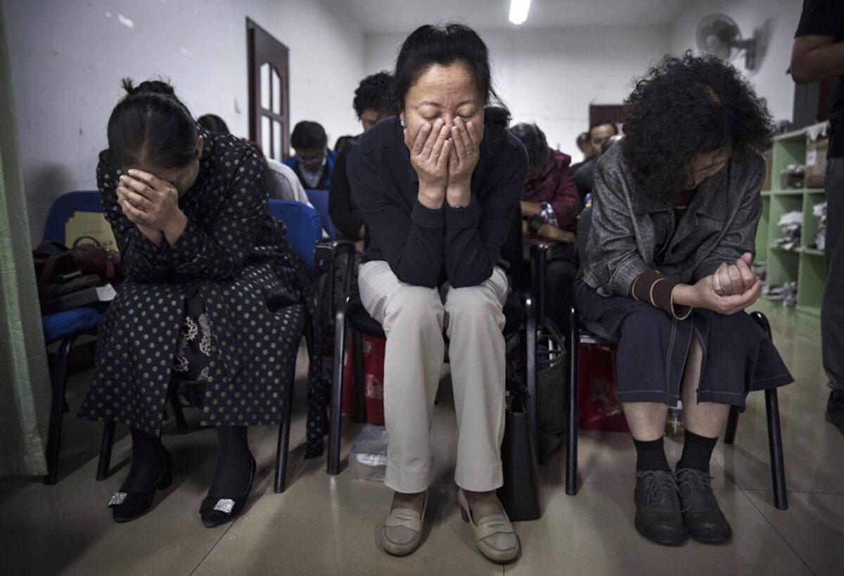 Chinese Christians pray during a service at an underground independent Protestant church in Beijing on Oct. 12, 2019. China, an atheist country, places a number of restrictions on Christians and allows legal practice of the faith only at state-approved churches. (Kevin Frayer/Getty Images)