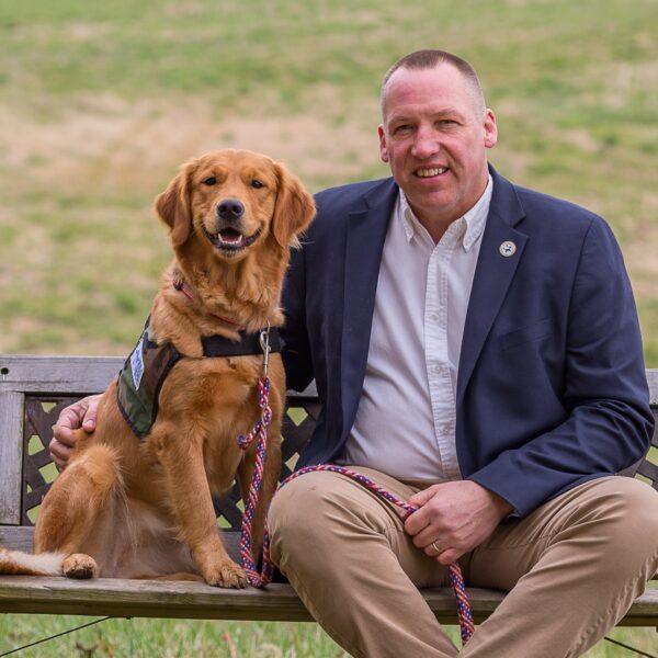 Rick Yount with a service dog named Jessie. (Courtesy of Warrior Canine Connection)