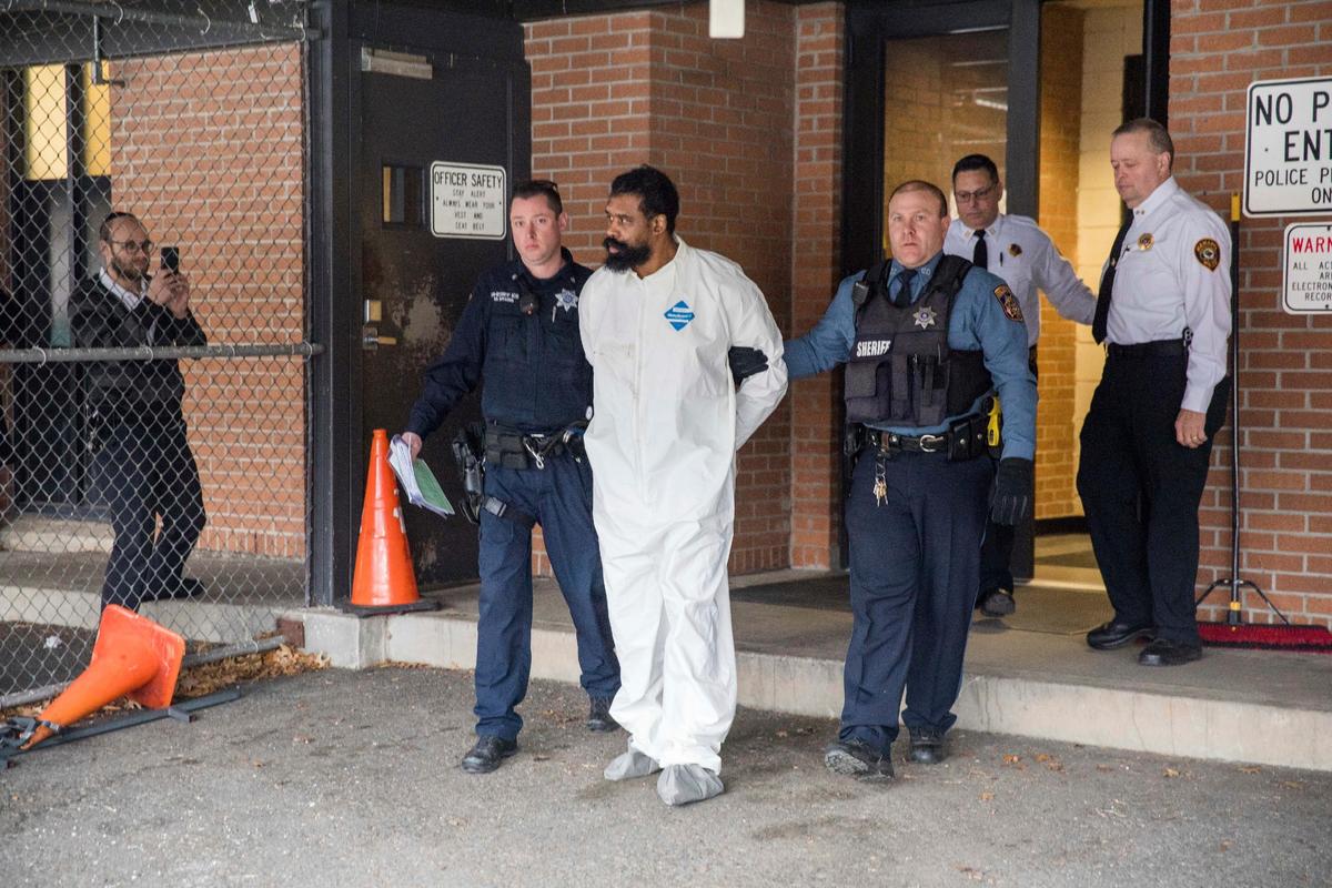 Ramapo police officers escort Grafton Thomas from Ramapo Town Hall to a police vehicle in Ramapo, New York, on Dec. 29, 2019. Thomas is accused of stabbing multiple people as they gathered to celebrate Hanukkah at a rabbi's home in the Orthodox Jewish community north of New York City. (Julius Constantine Motal/AP Photo)