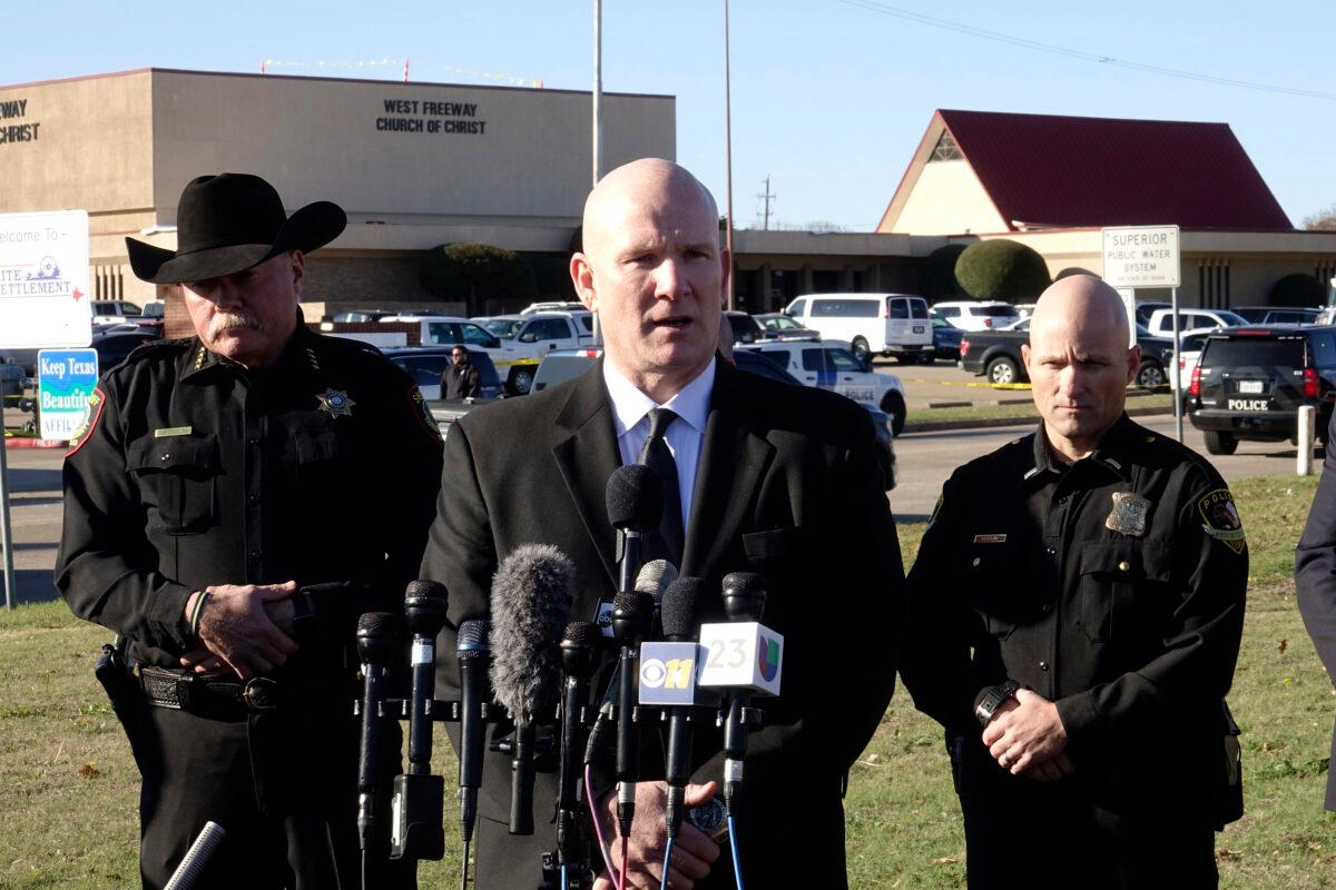 Texas Department of Public Safety regional director Jeff Williams speaks during a news conference, as Tarrant County Sheriff Bill Waybourn (L) and White Settlement Police Chief J.P. Bevering (R) stand behind him on Dec. 29, 2019, in front of West Freeway Church of Christ, in White Settlement, Texas. (David Kent/AP Photo)