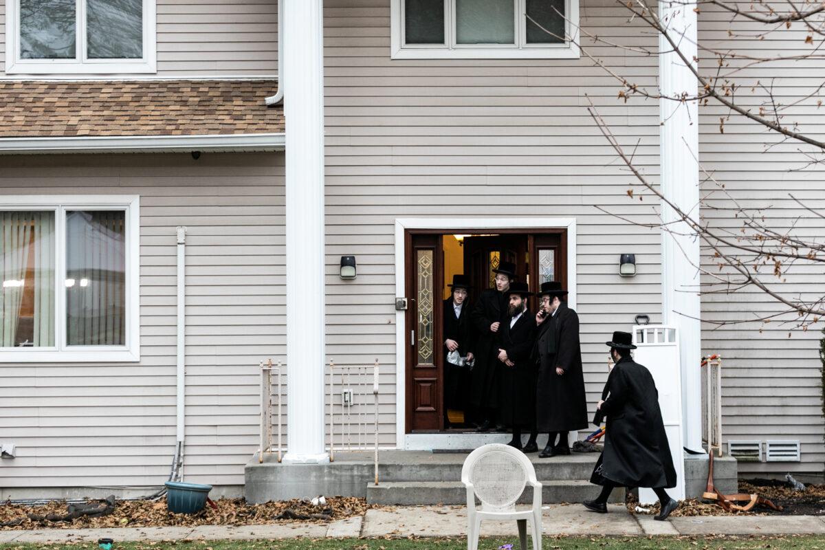 People gather at Rabbi Chaim Rottenberg's residence in Monsey, New York, on Dec. 29, 2019. (Jeenah Moon/Reuters)