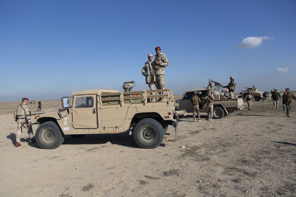 Iraqi army units are deployed during military operations of the Iraqi Army's Seventh Brigade in Anbar, Iraq, Dec. 29, 2019. An Iraqi general said Sunday that security has been beefed up around the Ain al-Asad airbase, a sprawling complex in the western Anbar desert that hosts U.S. forces, following a series of attacks. (Nasser Nasser/AP Photo)