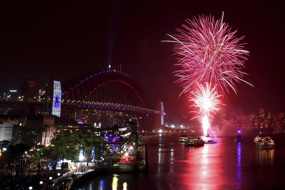 The 9 p.m. family fireworks explode over the Sydney Opera House and Sydney Harbour Bridge on Sydney Harbour during New Year's Eve celebrations in Sydney, Tuesday, Dec. 31, 2019. (Dean Lewins/AAP Image via AP)