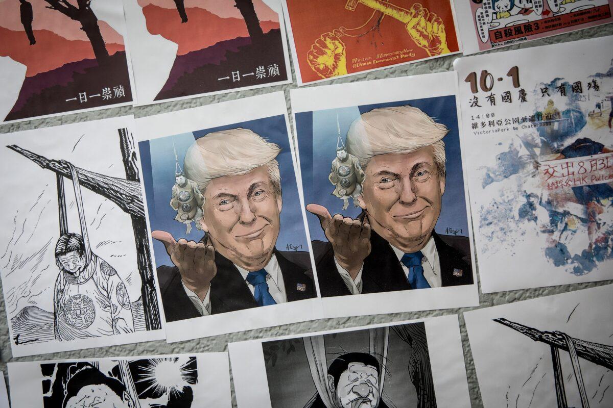 A poster showing President Donald Trump is seen on a pro-democracy "Lennon Wall" ahead of a rally to mark the fifth anniversary of the 2014 Umbrella Movement in Hong Kong on Sept. 28, 2019. (Chris McGrath/Getty Images)