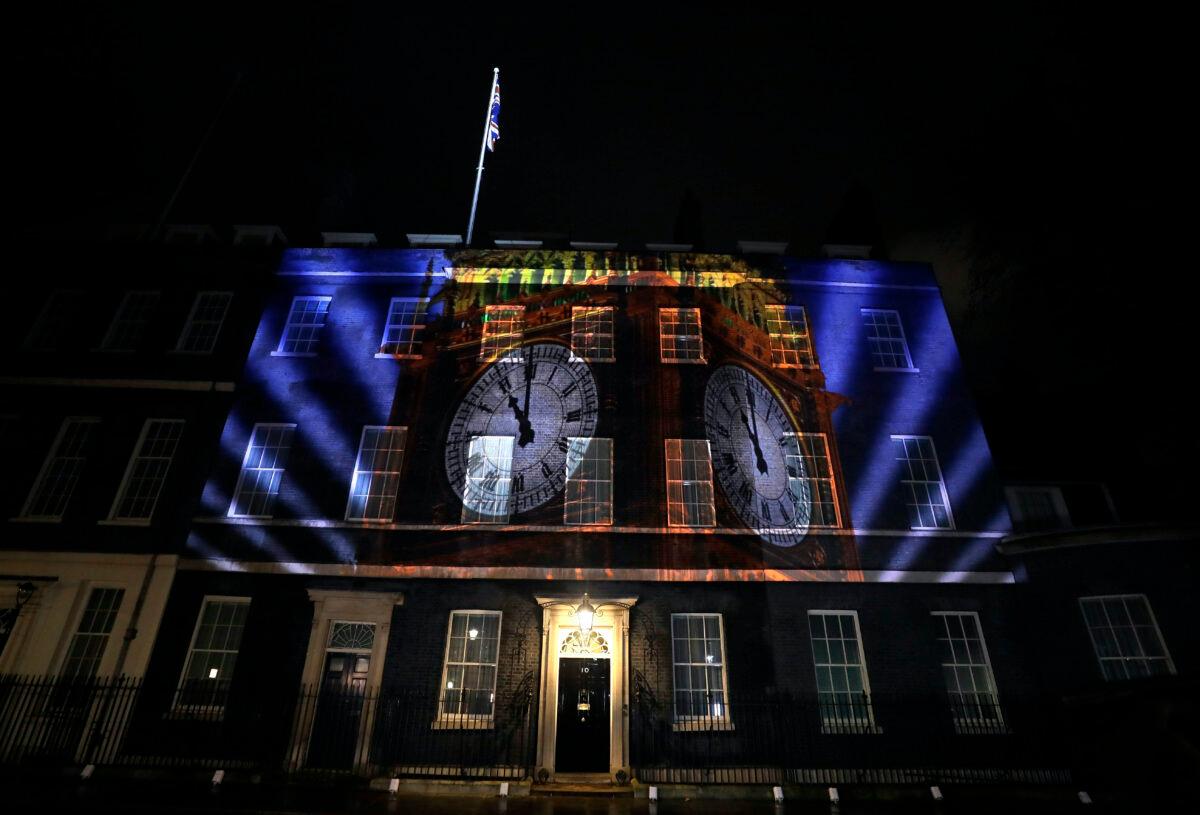 An image of the clock face of 'Big Ben' is projected onto the exterior of 10 Downing street, the residence of the British Prime Minister, in London as Britain left the European Union on Friday, Jan. 31, 2020. (Kirsty Wigglesworth/AP Photo)
