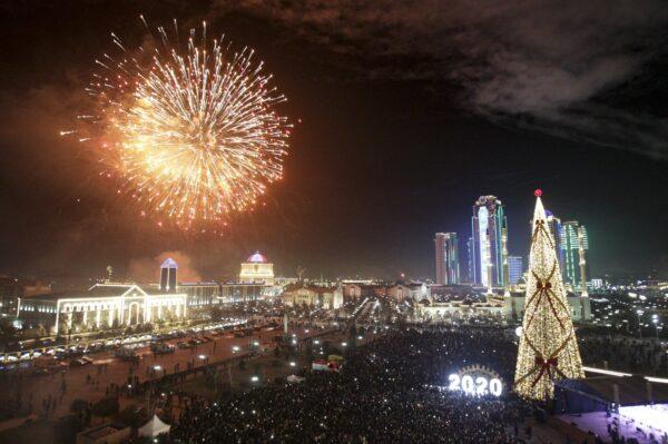 Fireworks explode over a Christmas tree and skyscrapers during New Year's celebrations in Grozny, Russia on Jan. 1, 2020. (Musa Sadulayev/AP)