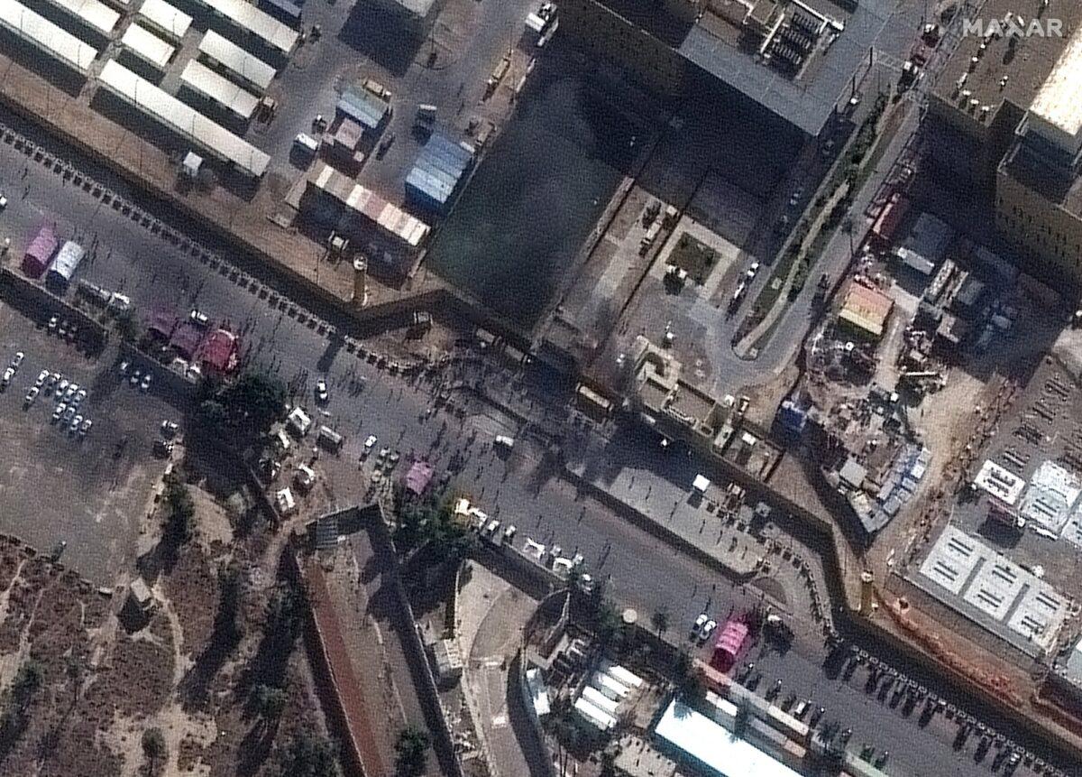 Maxar Technologies shows black smoke coming out of the U.S. Embassy compound in Baghdad, Iraq, on Jan. 1, 2020. (Satellite image ©2020 Maxar Technologies via AP)