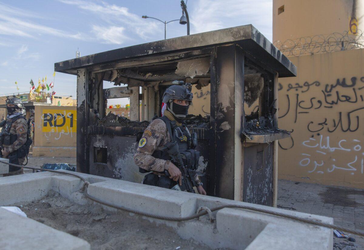 Iraqi army soldiers are deployed in front of the U.S. Embassy in Baghdad, Iraq, on Jan. 1, 2020. (Nasser Nasser/AP Photo)