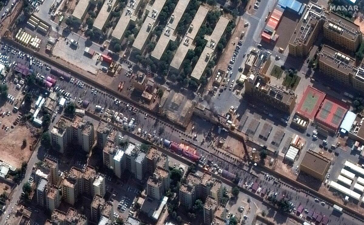 This Jan. 1, 2020, image provided by Maxar Technologies shows black smoke coming out of the U.S. Embassy compound in Baghdad. (Satellite image ©2020 Maxar Technologies via AP)