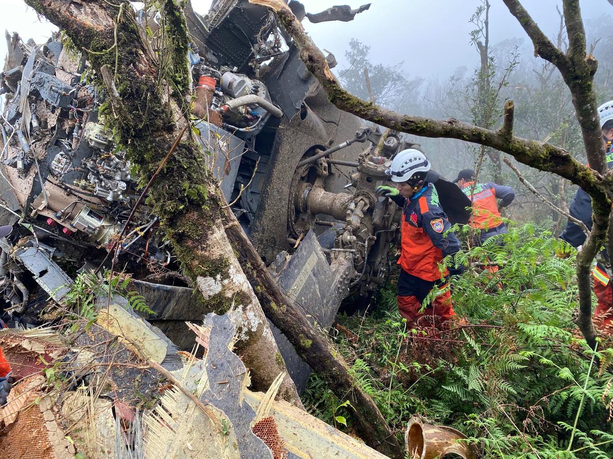 A rescue team searches for missing military officers, after a Black Hawk helicopter made a forced landing at a mountainous area near Taipei, Taiwan on Jan. 2, 2020. (Yilan County Fire Bureau/Handout via Reuters)
