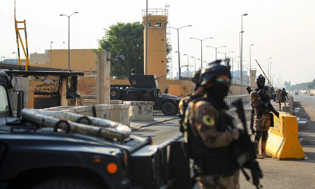 Iraqi counter-terrorism forces stand guard in front of the U.S. embassy in the capital Baghdad on Jan. 2, 2020. (Ahmad al-Rubaye/AFP via Getty Images)