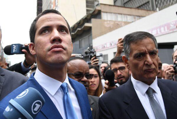 Venezuelan opposition leader Juan Guaido, left, who many nations have recognized as the country's rightful interim ruler, arrives at the National Assembly in Caracas, where he is due to be voted in for a second term as parliament speaker, on Jan. 5, 2020. (Yuri Cortez/AFP via Getty Images)