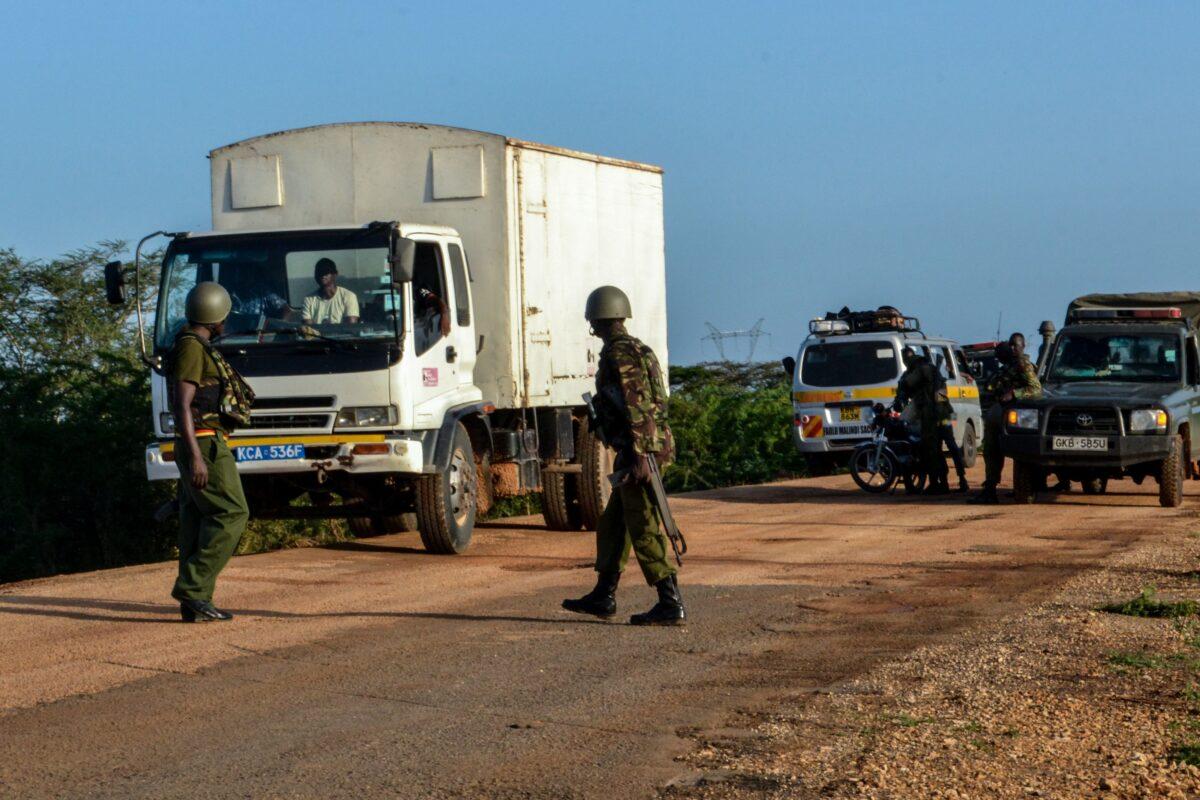 Kenyan police officers checking vehicles after an ambush by gunmen in Lamu county, Kenya, on Jan. 2, 2020. (Stringer/AFP/Getty Images)