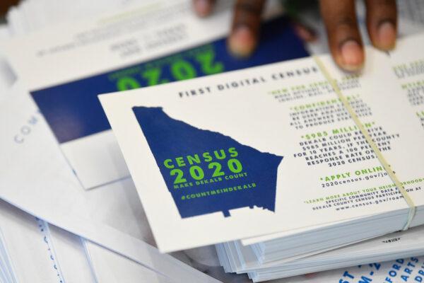A worker gets ready to pass out instructions on how to fill out the 2020 Census during a town hall meeting in Lithonia, Ga., on Aug. 13, 2019. (John Amis, File/AP Photo)