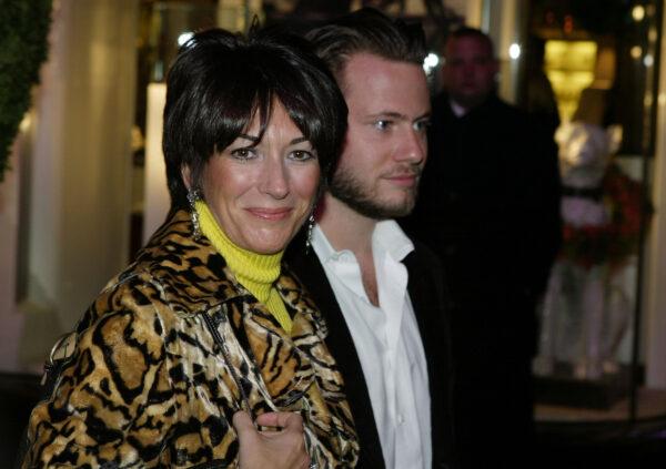 Socialite Ghislaine Maxwell with an unidentified male companion attends the Opening of the Asprey Flagship Store on 5th Avenue in New York City on Dec. 8, 2003. (Mark Mainz/Getty Images)