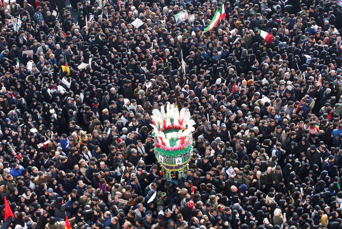 Iranian people attend a funeral procession for Iranian Maj. Gen. Qassem Soleimani, head of the elite Quds Force and Iraqi militia commander Abu Mahdi al-Muhandis, who were killed in an airstrike at Baghdad airport, in Tehran, Iran, on Jan. 6, 2020. (Nazanin Tabatabaee/WANA (West Asia News Agency) via Reuters)