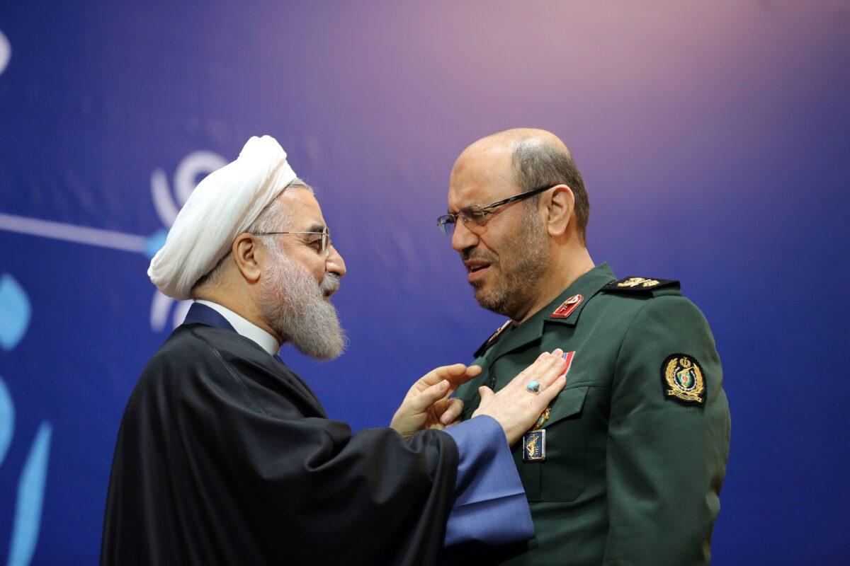 Iranian President Hassan Rouhani, left, awards Iran's Defense Minister Hossein Dehghan with the Medal of Honor for his role in the implementation of a nuclear deal with world powers, in Tehran on Feb. 8, 2016. (Atta Kenare/AFP via Getty Images)