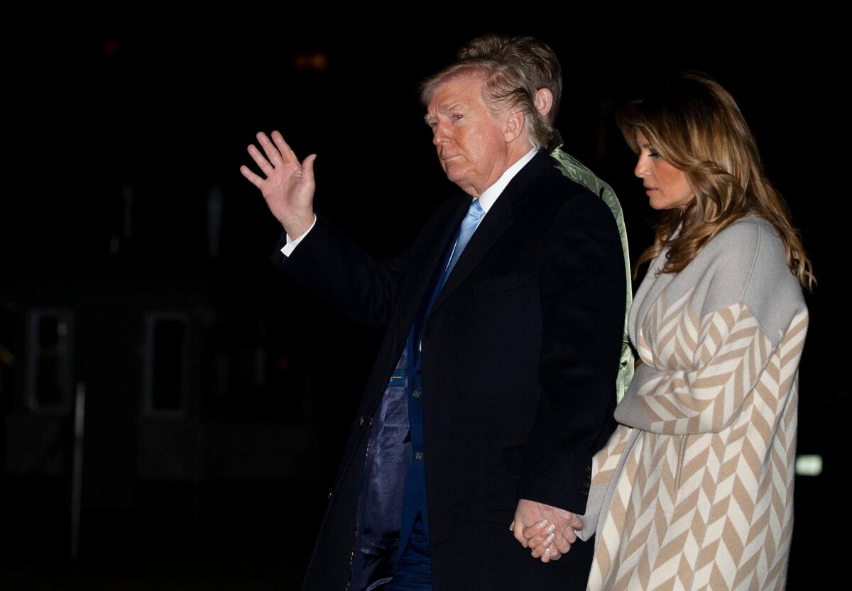 President Donald Trump and first lady Melania Trump arrive at the White House on Jan. 5, 2020 in Washington. The Trumps were returning from spending the holidays at Mar-a-Lago in Palm Bach, Florida after last week’s U.S. drone strike that killed Iranian military leader, Major Gen. Qassem Soleimani. Tasos Katopodis/Getty Images)