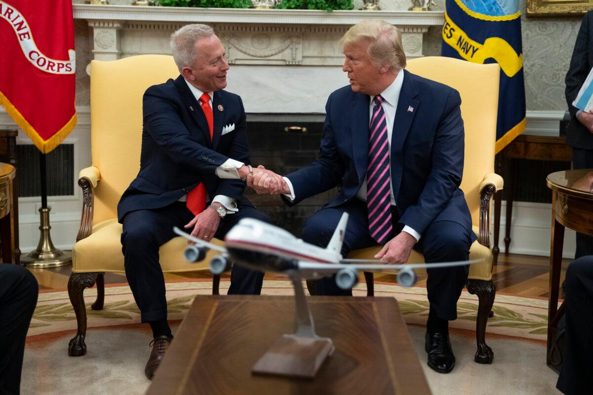 President Donald Trump meets with Rep. Jeff Van Drew (R-N.J.) in the Oval Office of the White House in Washington on Dec. 19, 2019. (Evan Vucci/AP Photo)
