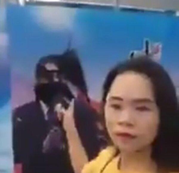 Dong Yaoqiong, a former real estate agent in Shanghai, live-streamed herself on Twitter on July 4, 2018, splashing ink on a propaganda poster bearing Xi Jinping’s image. Dong was recently released after she was subjected to “compulsory treatment” in a psychiatric hospital for more than a year. (Screenshot from Dong's Twitter video)