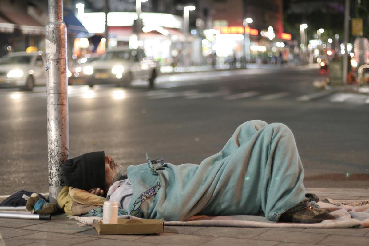 A homeless man sleeps on the street in Austin, Texas. (Courtesy of Judith Knotts)
