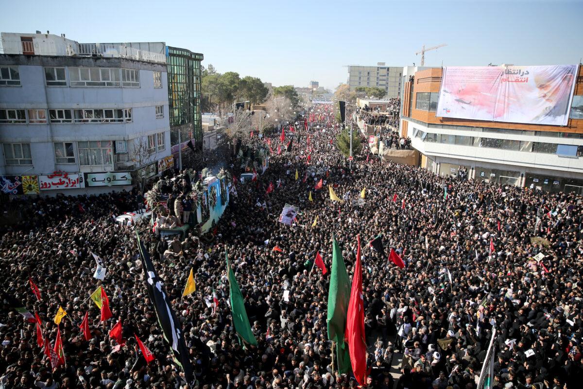 Iranian people attend a funeral procession and burial for Iranian General Qassem Soleimani, head of the elite Quds Force, who was killed in an air strike at Baghdad airport, at his hometown in Kerman, Iran, on Jan. 7, 2020. (Mehdi Bolourian/Fars News Agency/WANA/West Asia News Agency via Reuters)