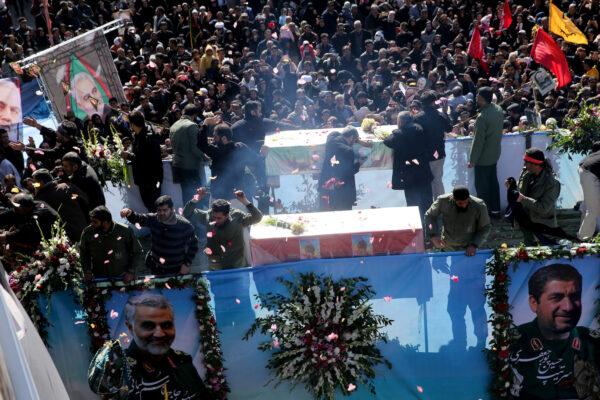 Iranian people attend a funeral procession and burial for Iranian Major-General Qassem Soleimani, head of the elite Quds Force, who was killed in an air strike at Baghdad airport, at his hometown in Kerman, Iran on Jan. 7, 2020. (Mehdi Bolourian/Fars News Agency/WANA/West Asia News Agency via Reuters)