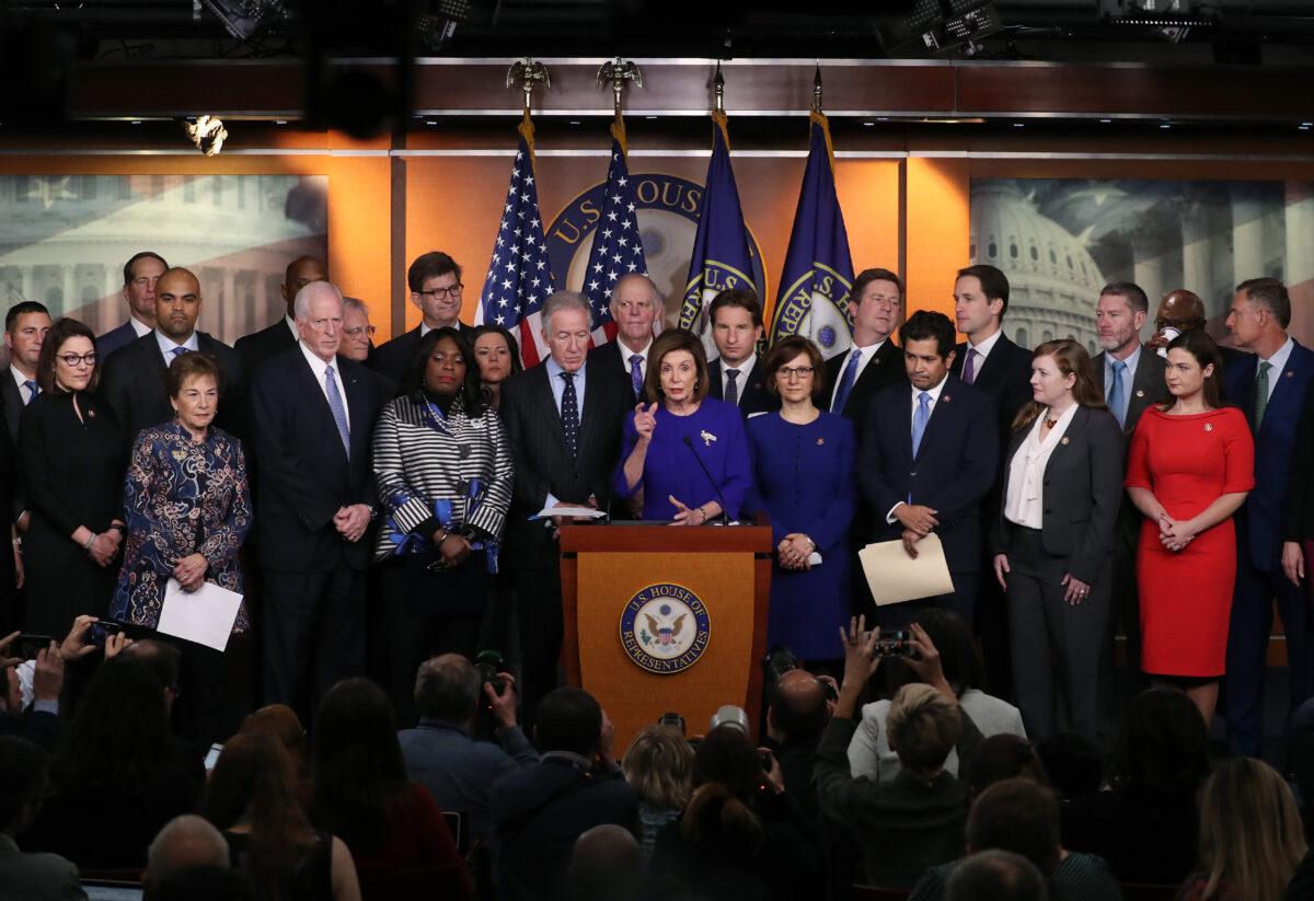 House Speaker Nancy Pelosi (D-Calif.) speaks while flanked by fellow members during a news conference announcing their support for the USMCA trade agreement, on Capitol Hill in Washington on Dec. 10, 2019. (Mark Wilson/Getty Images)