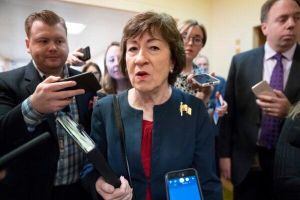 In this Nov. 6, 2019, file photo, Sen. Susan Collins (R-Maine) is surrounded by reporters as she heads to vote at the Capitol in Washington. (J. Scott Applewhite/AP Photo)