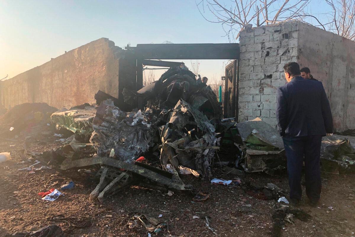 Debris is seen from a plane crash on the outskirts of Tehran, Iran, Jan. 8, 2020. (AP Photos/Mohammad Nasiri)