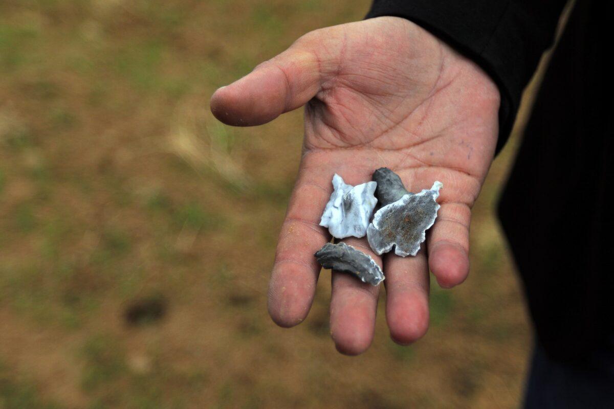 A man holds shrapnel from a missile launched by Iran on U.S.-led coalition forces on the outskirts of Duhok, Iraq, on Jan. 8, 2020. (Ari Jalal/Reuters)