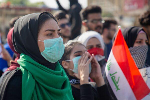 Iraqi students march during ongoing anti-government demonstrations in the southern city of Basra on Jan. 8, 2020. (Hussein Faleh/AFP via Getty Images)