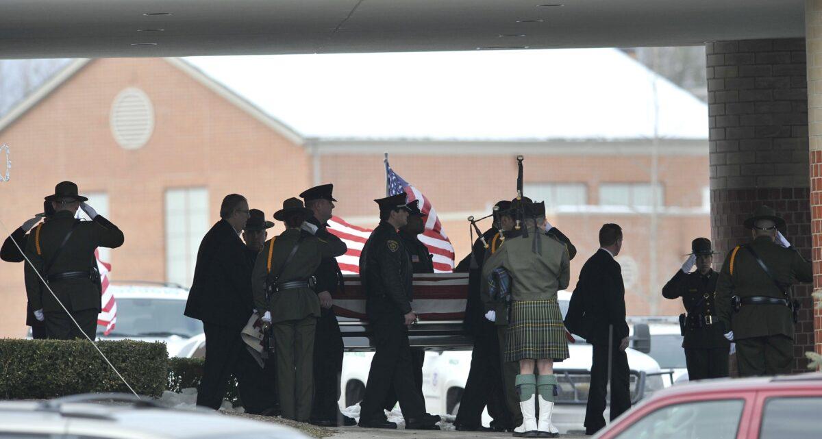 Law enforcement officers carry the casket of Border Patrol officer and former U.S. Marine Brian Terry out of Greater Grace Temple after his funeral service in Detroit, on Dec. 22, 2010. (John T. Greilick/Detroit News via AP)