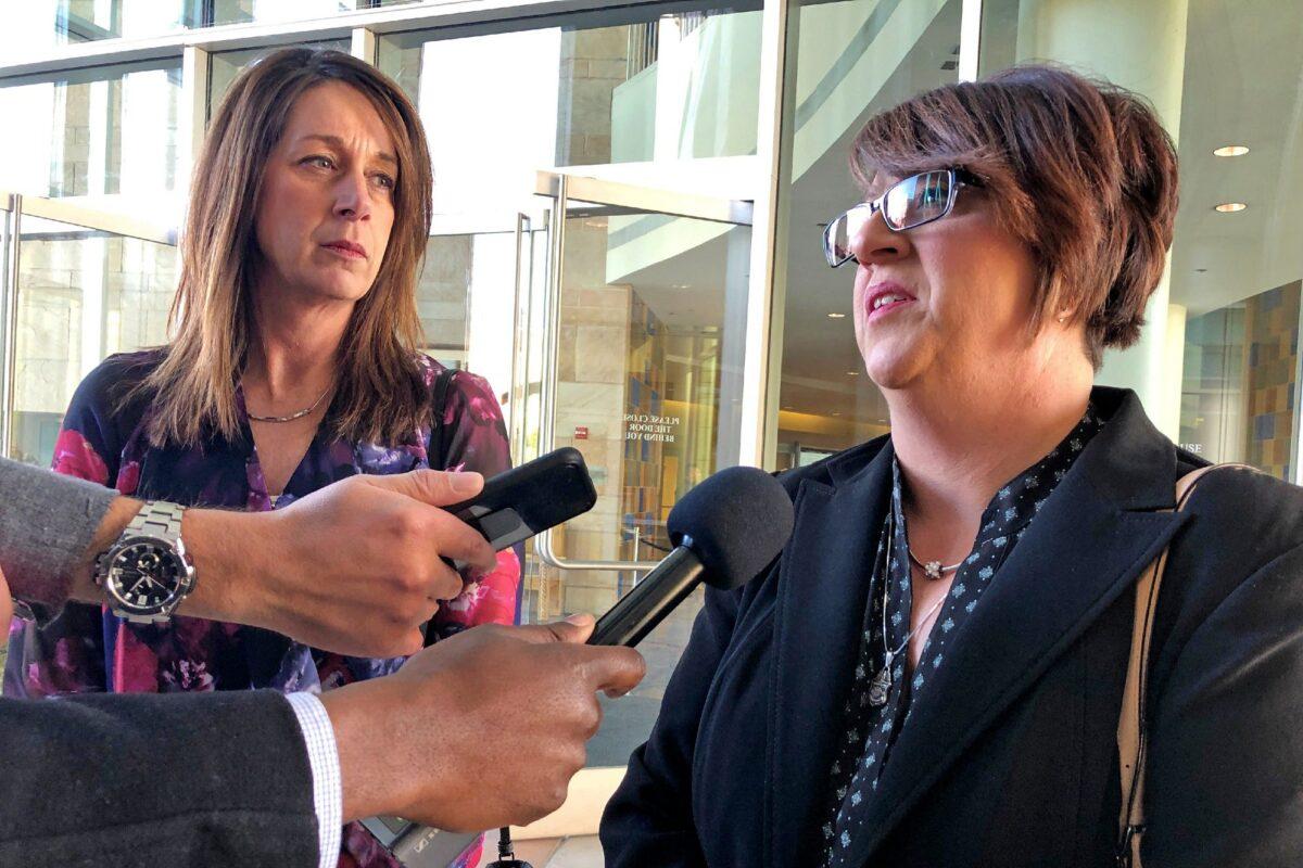 Michelle Balogh (R) and Kelly Willis speak to reporters on Jan. 8, 2020 following the sentencing of the Mexican man who killed their brother, U.S. Border Patrol agent Brian Terry, in December 2010, outside court in Tucson, Ariz. (Astríd Galván)