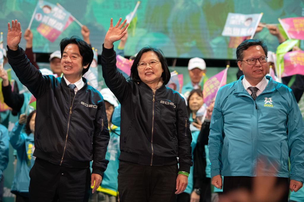 Taiwanese President Tsai Ing-wen (C) and her running mate William Lai (L) wave to supporters during a rally in Taoyuan, Taiwan, on Jan. 8, 2020. (Carl Court/Getty Images)