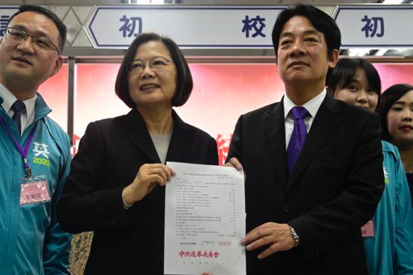 Taiwan's President Tsai Ing-wen (2nd L) and former premier William Lai (R) display a certificate after registering as presidential and vice presidential candidates for the upcoming election at the Central Elections Committee in Taipei on Nov. 19, 2019. Sam Yeh/AFP via Getty Images