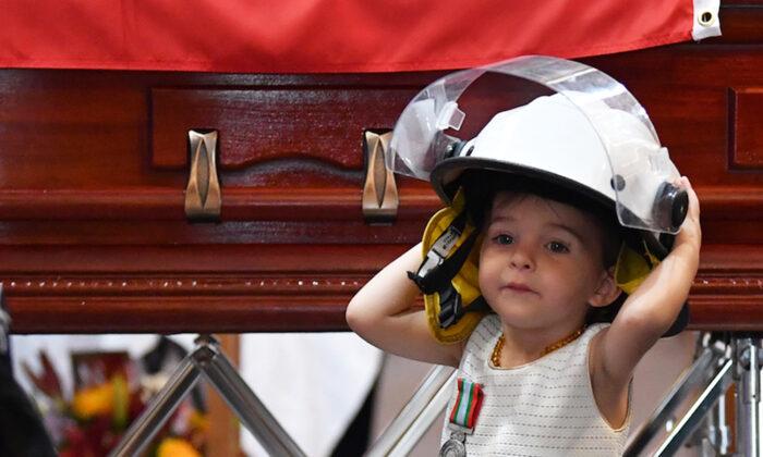 Daughter of Fallen Firefighter Dons Father’s Helmet at His Funeral, Receives His Medal for Bravery