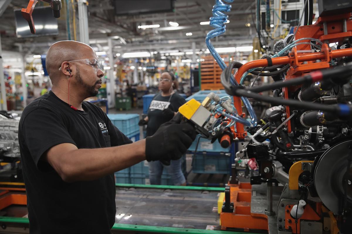Workers assemble Ford vehicles at the company's Chicago assembly plant on June 24, 2019. (Scott Olson/Getty Images)