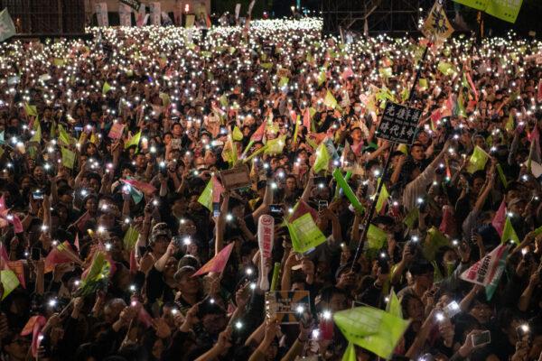 Supporters wave flags and smartphone lights during an election rally for Taiwan's current president and Democratic Progressive Party presidential candidate, Tsai Ing-wen, ahead of Saturday's presidential election in Taipei, Taiwan on Jan. 10, 2020. (Carl Court/Getty Images)