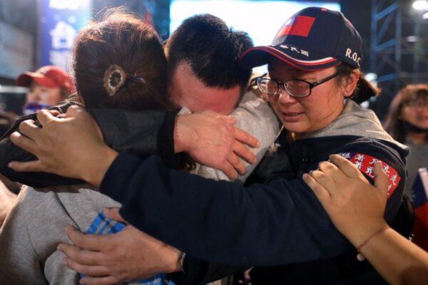 Supporters of Kuomintang party's presidential candidate Han Kuo-yu cry after he admits defeat in presidential election in Kaohsiung, Taiwan Jan. 11, 2020. (Reuters/Ann Wang)