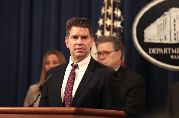 FBI Deputy Director David Bowdich speaks while Attorney General Bill Barr (R) and justice officials look on during a press conference at the Justice Department in Washington on Jan, 13, 2020. (Charlotte Cuthbertson/The Epoch Times)