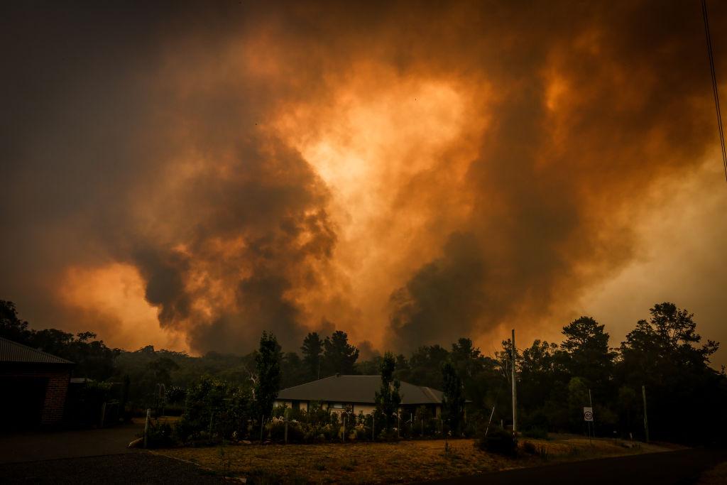Two bushfires simultaneously approach a home on the outskirts of Bargo in Sydney, Australia, on Dec. 21, 2019. (©Getty Images | <a href="https://www.gettyimages.com/detail/news-photo/two-bushfires-approach-a-home-located-on-the-outskirts-of-news-photo/1195172379?adppopup=true">David Gray</a>)