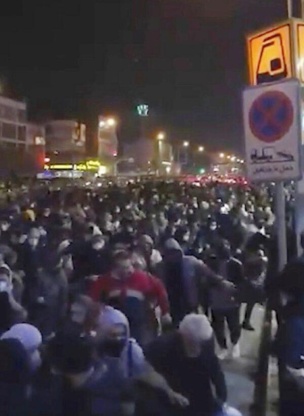 A crowd fleeing police near Freedom Square in Tehran, Iran, on Jan. 12, 2020. (Center for Human Rights in Iran via AP)